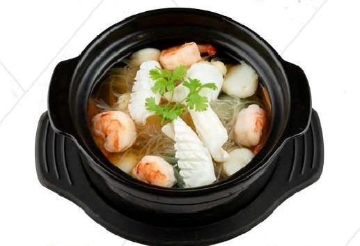 Seafood soup with mixed vegetables in clay pot